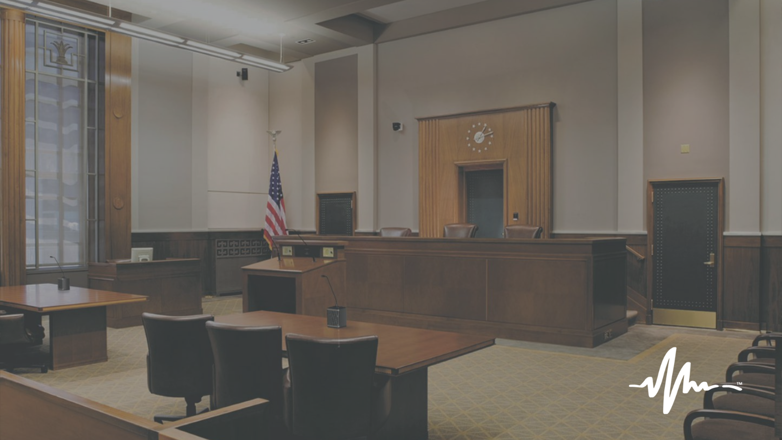 An image of a high-tech courtroom implemented by For The Record.