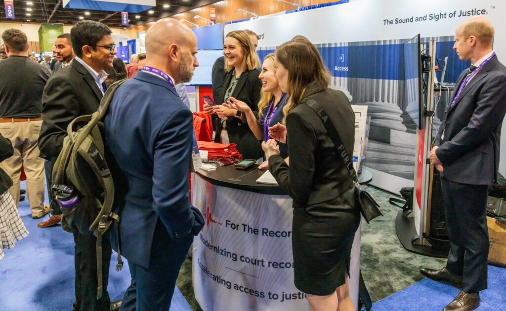 People in a tradeshow booth