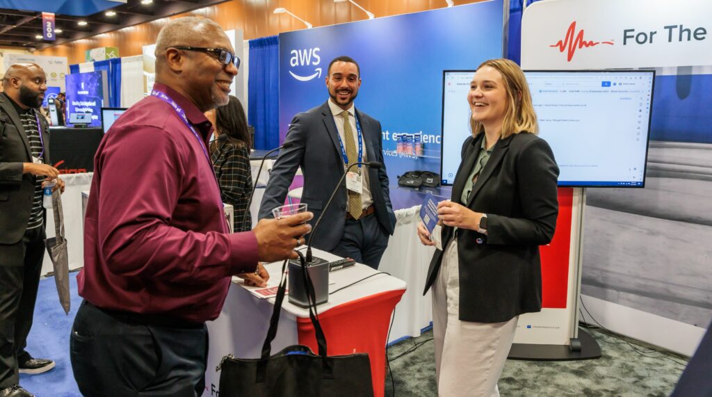 People in a tradeshow booth