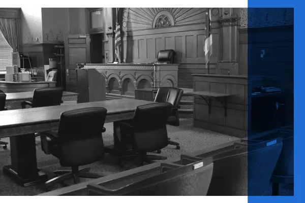 Black and white image of an empty courtroom