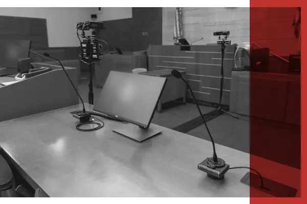 Black and white image of technology in a courtroom