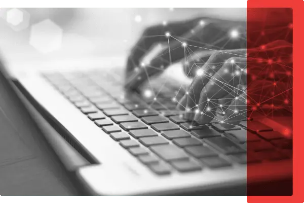 Black and white image of Hands typing on Keyboard with a light Red Overlay